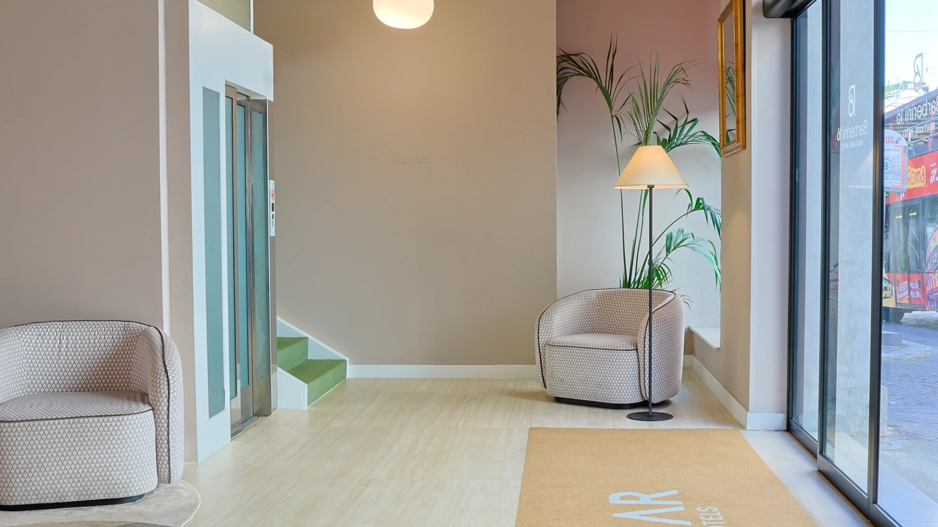 Stylish entrance lobby featuring a modern elevator and a custom BZAR rug for adult guests. - Barberini 16 Boutique Hotel, BZAR hotels in Rome